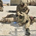 Soldier assesses casualty during CLS refresher course