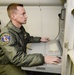 461st Air Control Wing communications system technician works aboard an E-8C Joint STARS