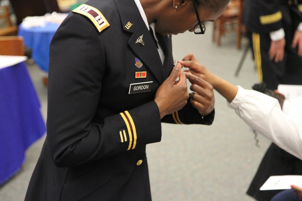 Young student asks soldier about her uniform