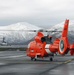 Coast Guard MH-65 Dolphin helicopter crews depart Air Station Kodiak, Alaska