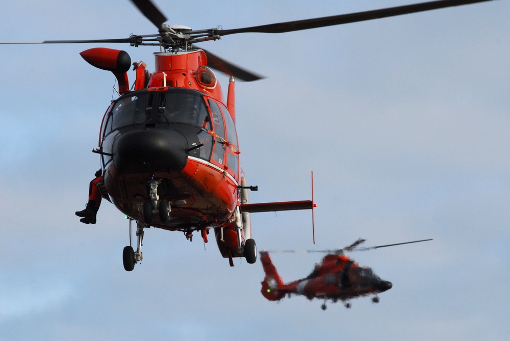 Coast Guard MH-65 Dolphin helicopter crews conduct vertical surface training in Kodiak, Alaska