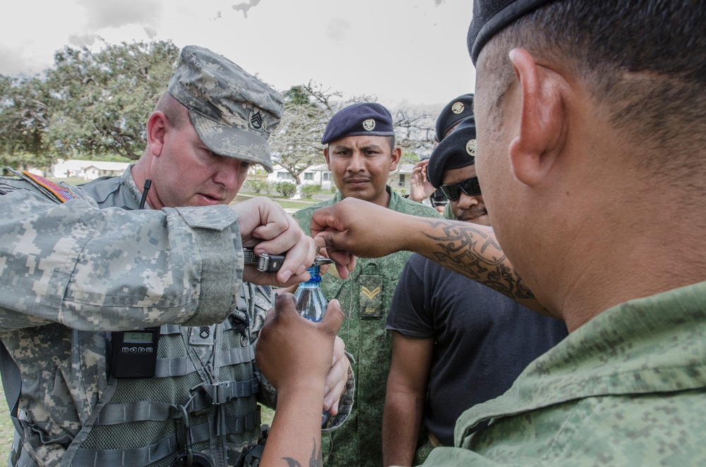 US and Belize military train on non-lethal weapons during Fused Response 2014