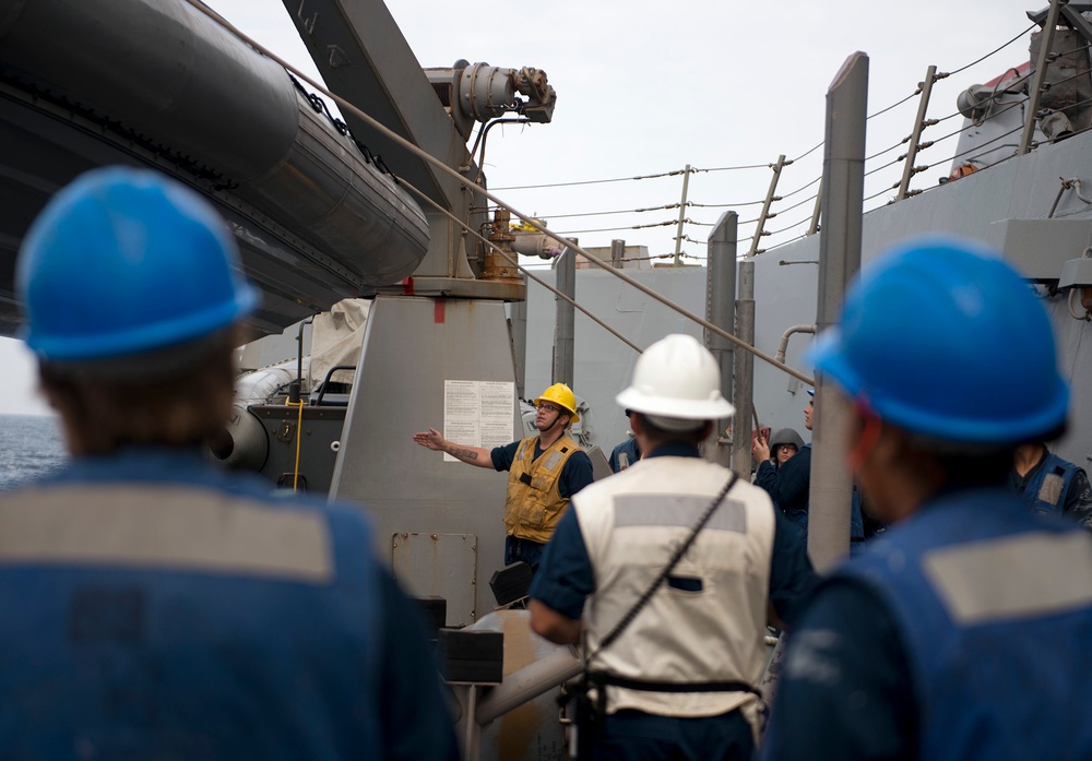 USS Bulkeley sailors lower a rigid hull inflatable boat