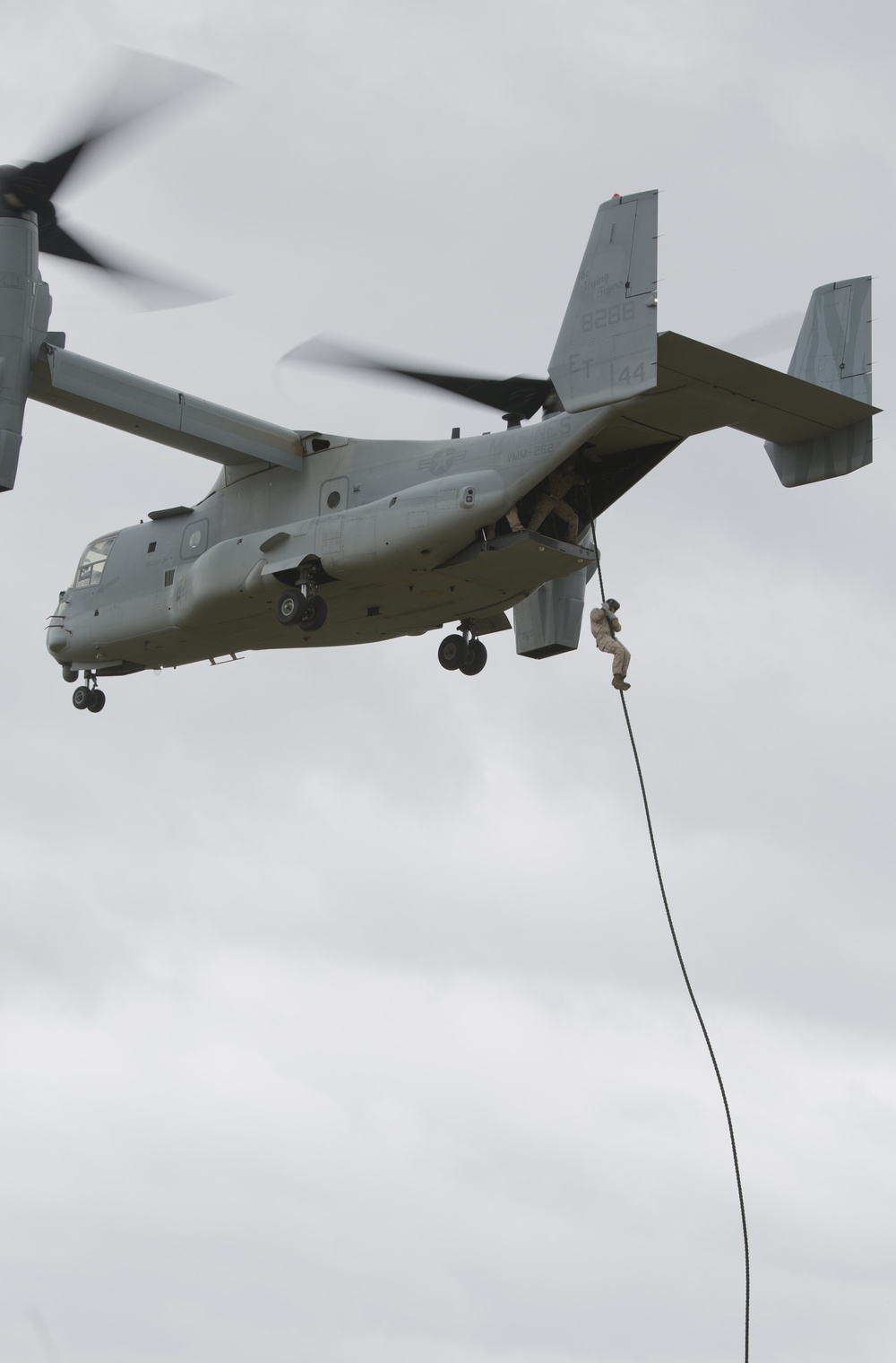 Recon Marines fast-rope from Ospreys