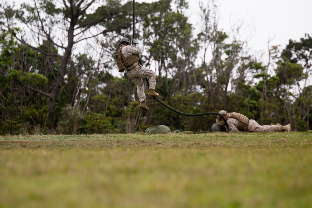 Recon Marines fast-rope from Ospreys