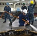 Sailors clean anchor