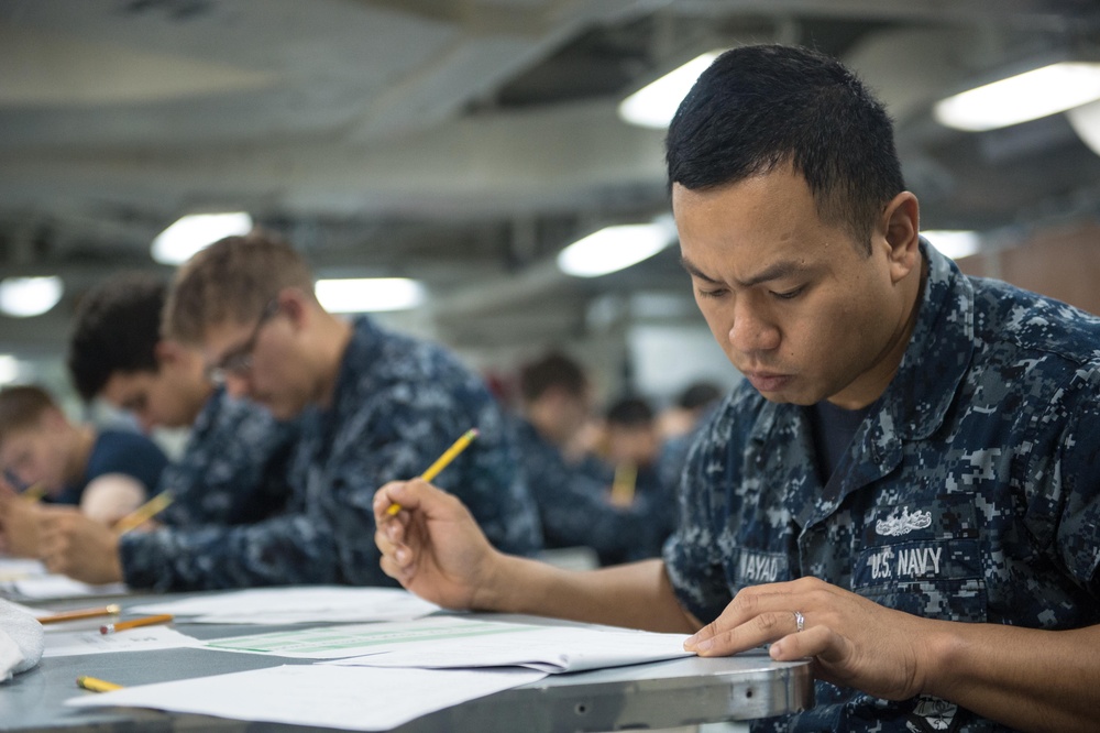 Denver sailors take E-4 Advancement Exam underway