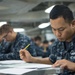 Denver sailors take E-4 Advancement Exam underway