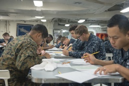 Denver sailors take E-4 Advancement Exam underway