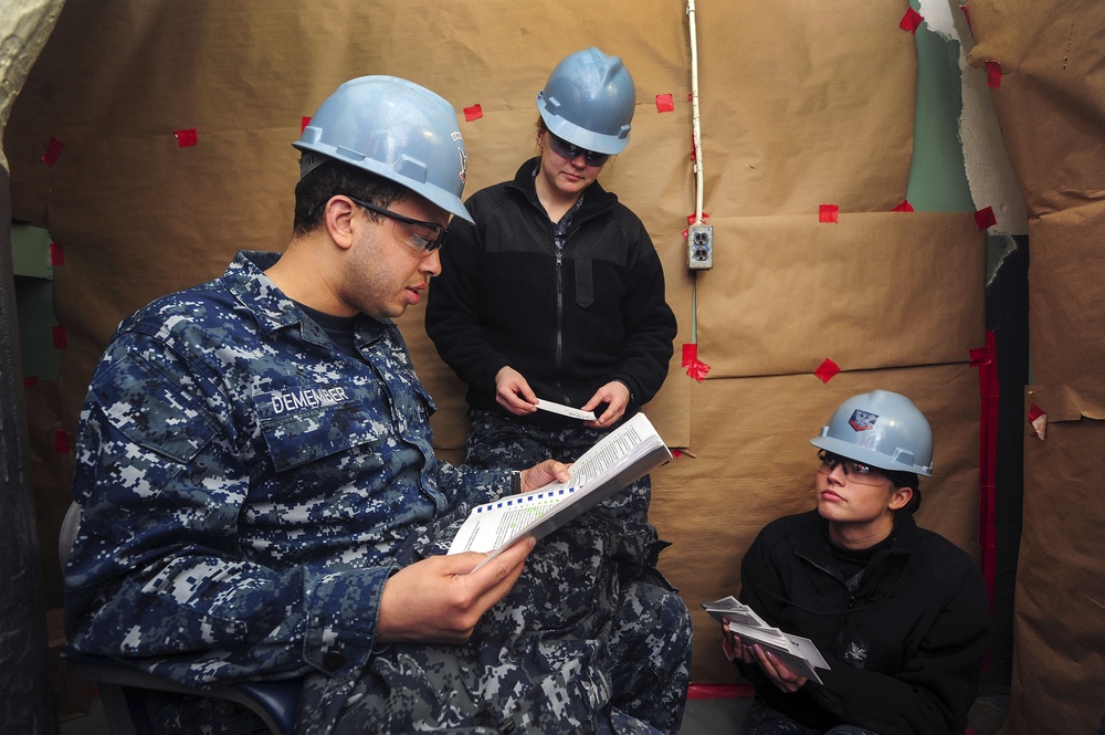 USS Dwight D. Eisenhower sailors study for Navy-wide advancement exam