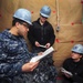 USS Dwight D. Eisenhower sailors study for Navy-wide advancement exam