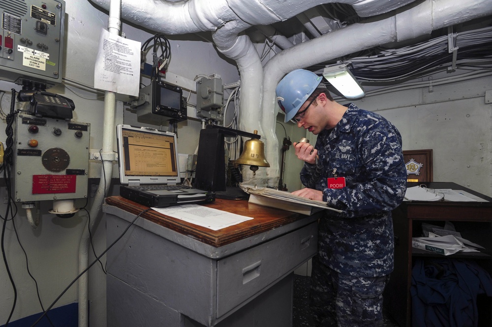 USS Dwight D. Eisenhower sailor stands petty officer of the watch