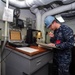 USS Dwight D. Eisenhower sailor stands petty officer of the watch