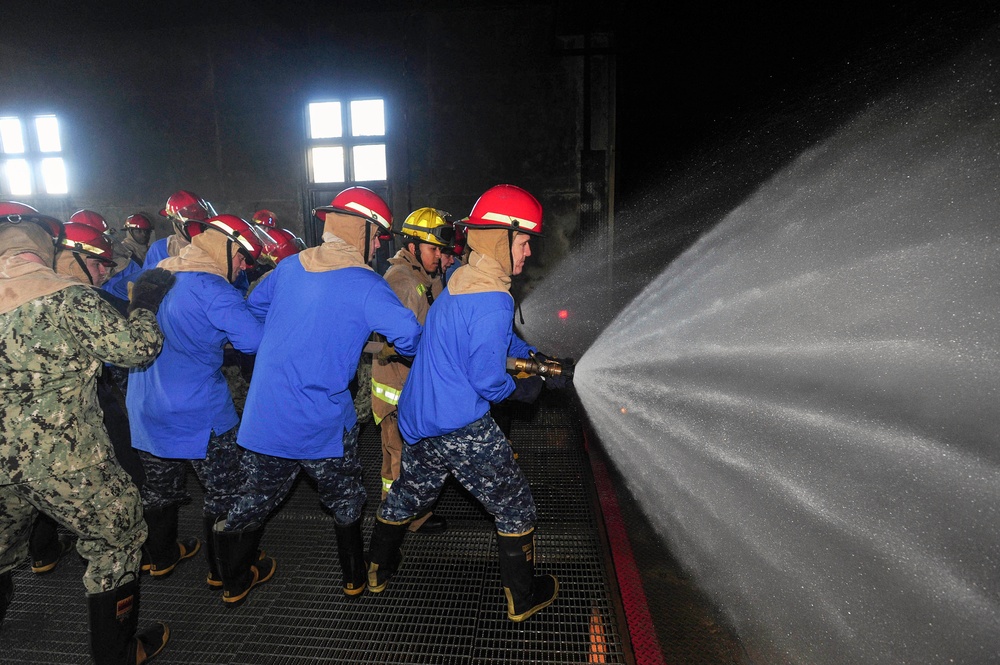 USS Dwight D. Eisenhower commanding officer receives firefighting training