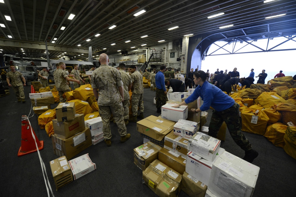 Sailors, Marines sort mail aboard USS Bataan