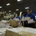 Sailors, Marines sort mail aboard USS Bataan