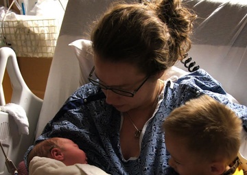 Contracting officer sees newborn son for first time through VTC