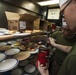 Marines and Sailors prepare lunch aboard the USS Bataan