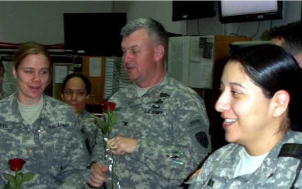 2nd Lt. Julia O'Neil receives a rose from Col. Hensley