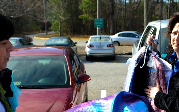 Spouses support school: FESC donates clothes to local school