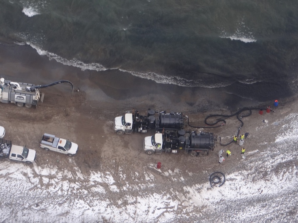 Crews recover discharged crude oil along Lake Michigan shore