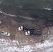 Crews recover discharged crude oil along Lake Michigan shore