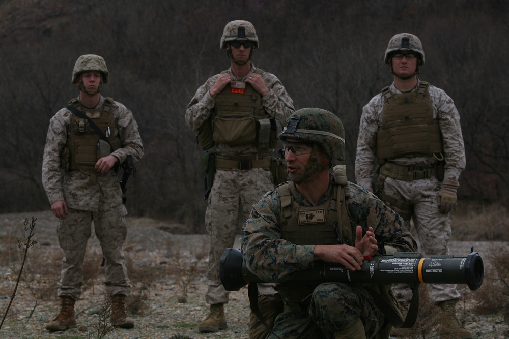 Marine from East Lansing, Mich. demonstrates how to use anti-tank weapon during Ssang Yong 14