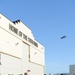 A C-130 flies over the ramp on Joint Base Elmendorf-Richardson