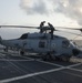 Sailors wash Seahawk aboard USS Halyburton