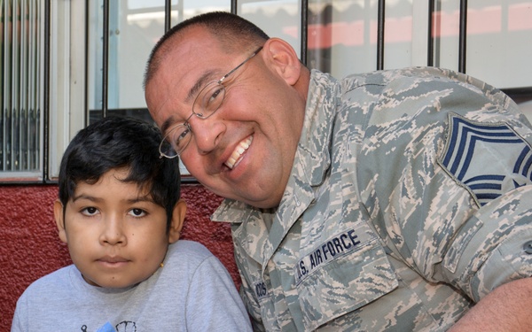 US airmen visit local children during assignment in Chile