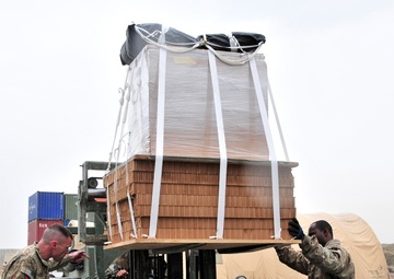 Riggers get ready to load up a bundle