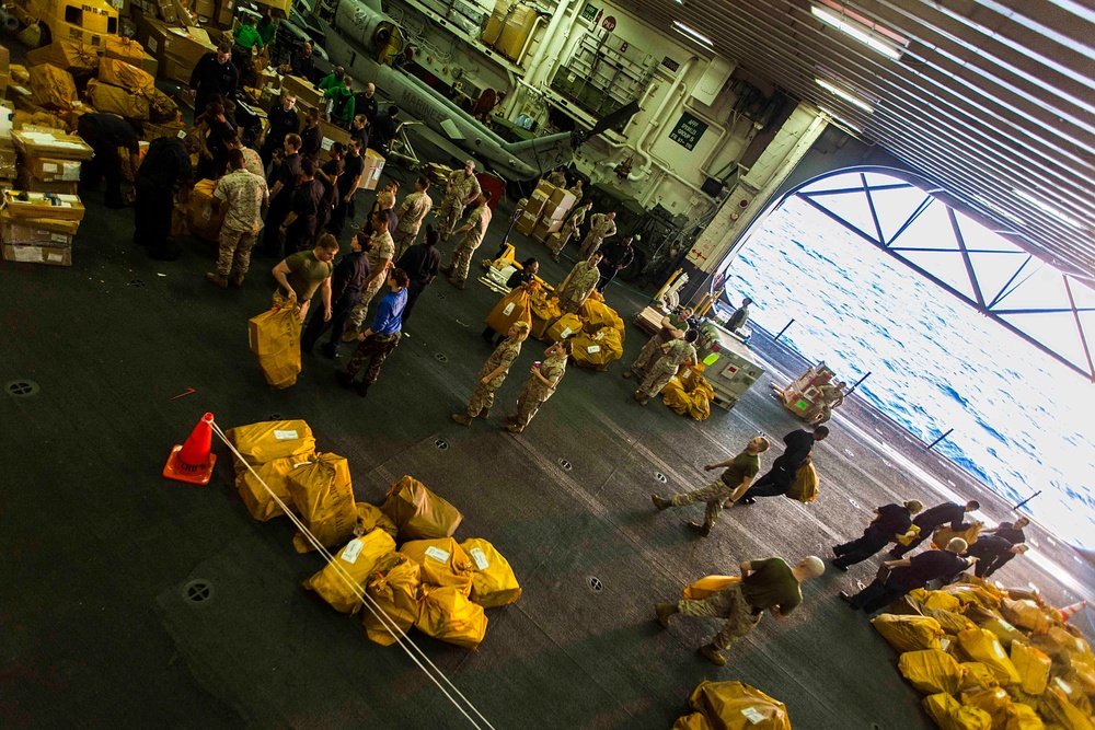 Marines and Sailors receive two tons of mail aboard the Bataan