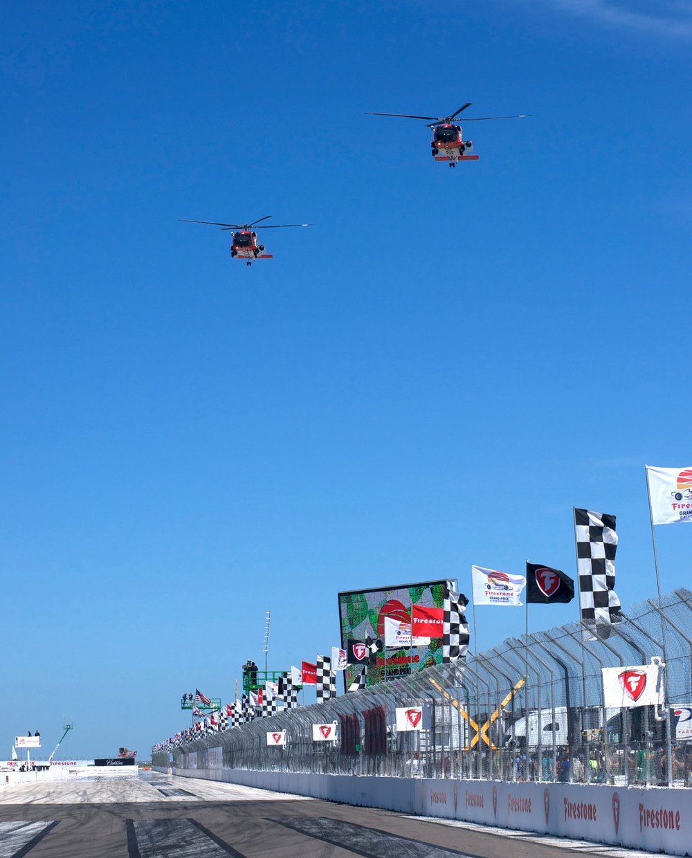 Coast Guard aircrews conduct fly over at Firestone Grand Prix in St. Petersburg, Fla.