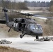 US Army UH-60 Black Hawk helicopter departs after offloading soldiers
