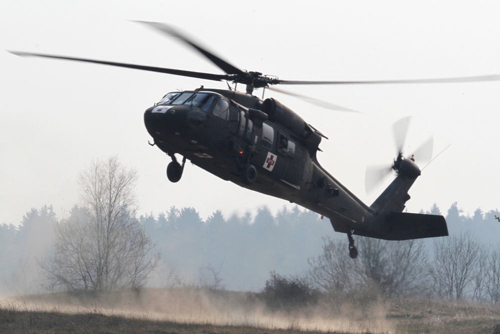 US Army UH-60 Black Hawk helicopter lands to pick up 'mock' wounded doldiers