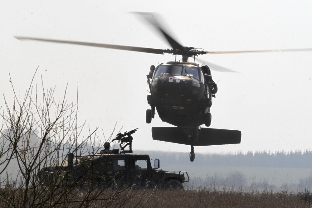 U.S. Army UH-60 Black Hawk helicopter prepares to land to pick up 'mock' wounded soldiers