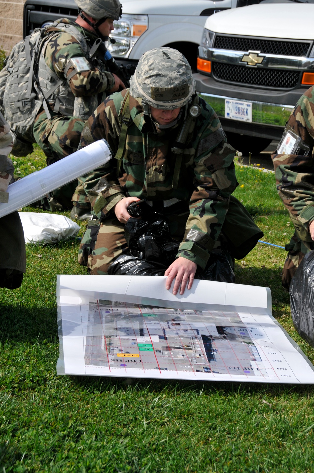 US Air Force Senior Master Sgt. Kosta Baladakis assigned to the 144th Air Expeditionary Wing (AEW), California Air National Guard, coordinates a sweep with the Post Attack and Reconnaissance Team (PAR Team).