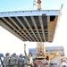 Soldiers from the 1438th Multi-Role Bridging Company repair a bridge on one of their last missions in Afghanistan