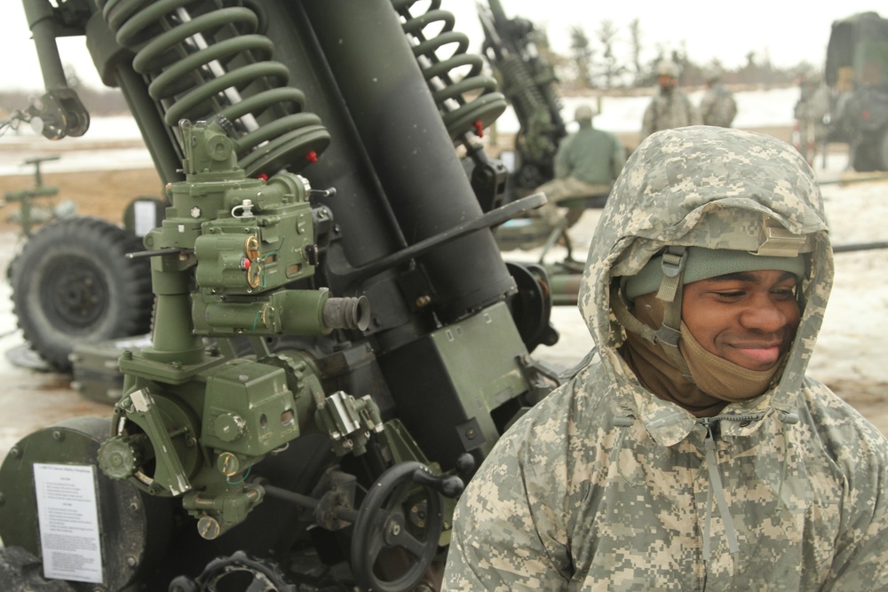 New York Army Guard artillerymen fire big guns at Fort Drum