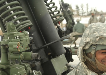 New York Army Guard artillerymen fire big guns at Fort Drum