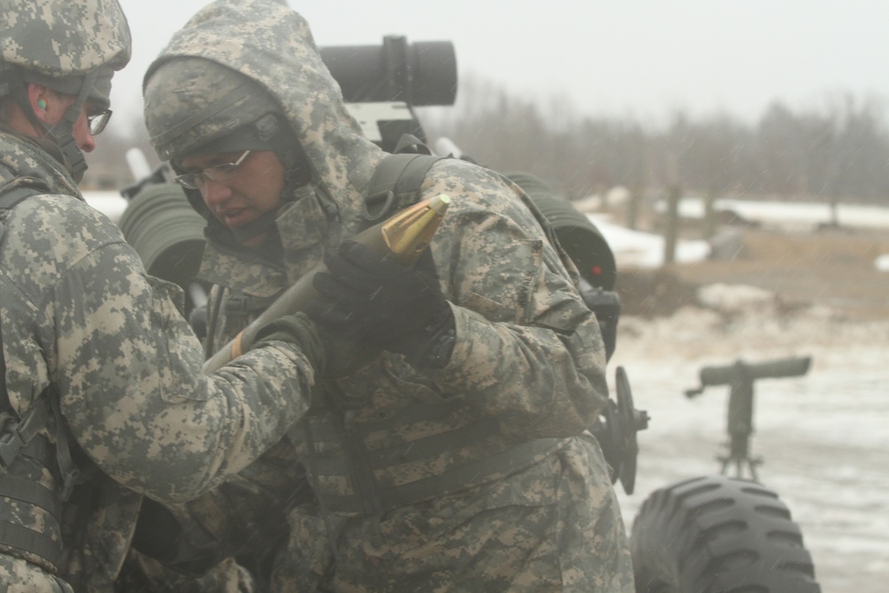 New York Army Guard artillerymen fire big guns at Fort Drum