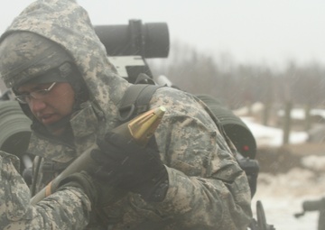 New York Army Guard artillerymen fire big guns at Fort Drum