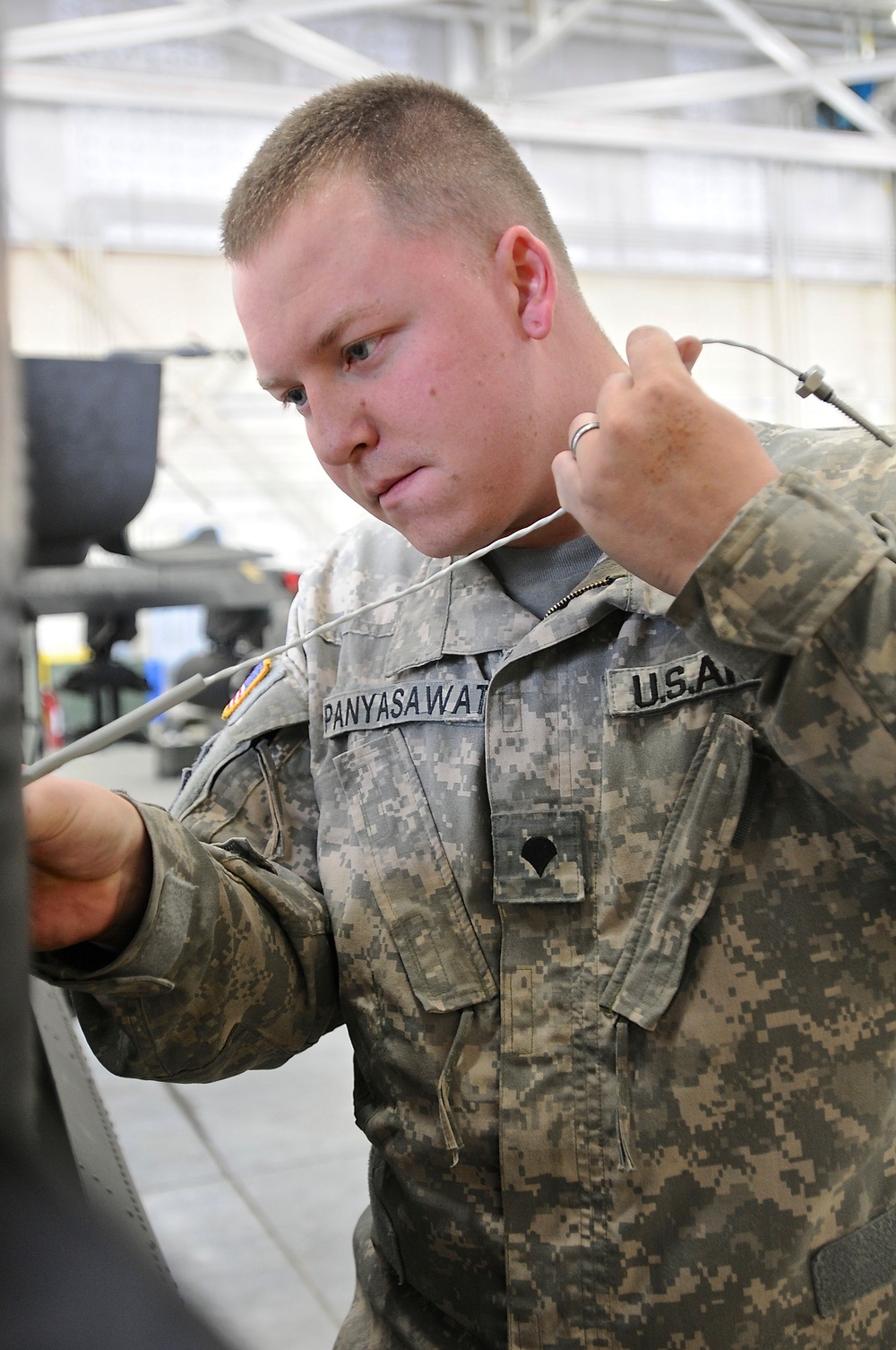 122nd ASB soldier repairs aircraft