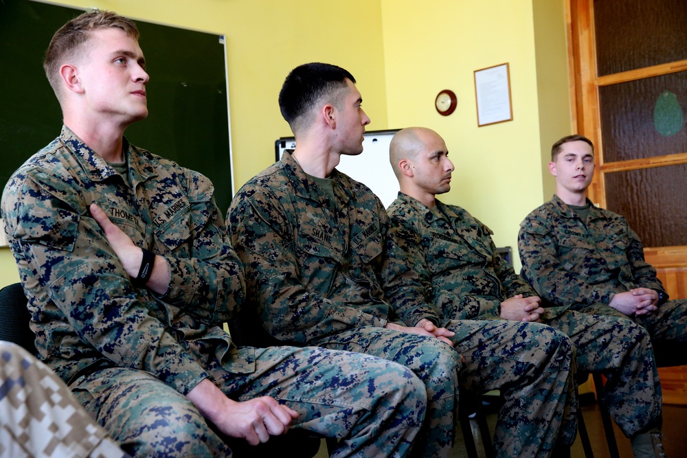U.S. and Estonian service members meet with Latvian high school students