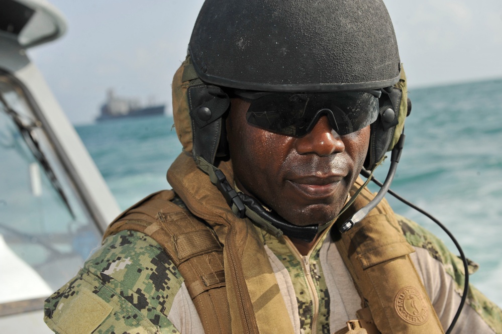 US Coast Guardsman steps up to the challenge; commands US Navy unit