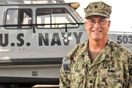 US Coast Guardsman steps up to the challenge; commands US Navy unit