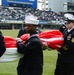 Sailors hold American flag for Chicago White Sox opening game