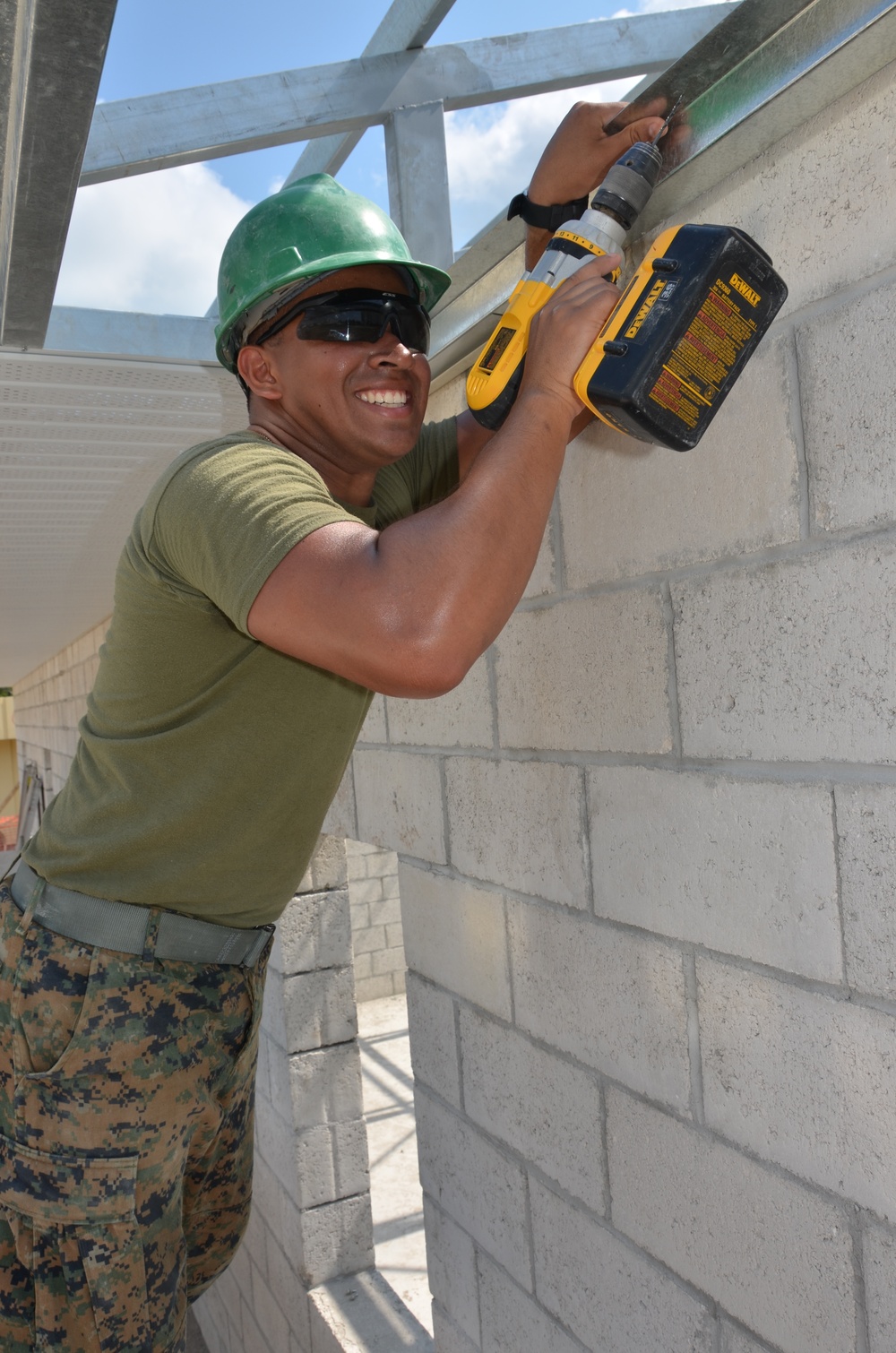 Engineers construct roof at Yorke school construction site in Belize City