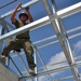 Engineers construct roof at Yorke school construction site in Belize City