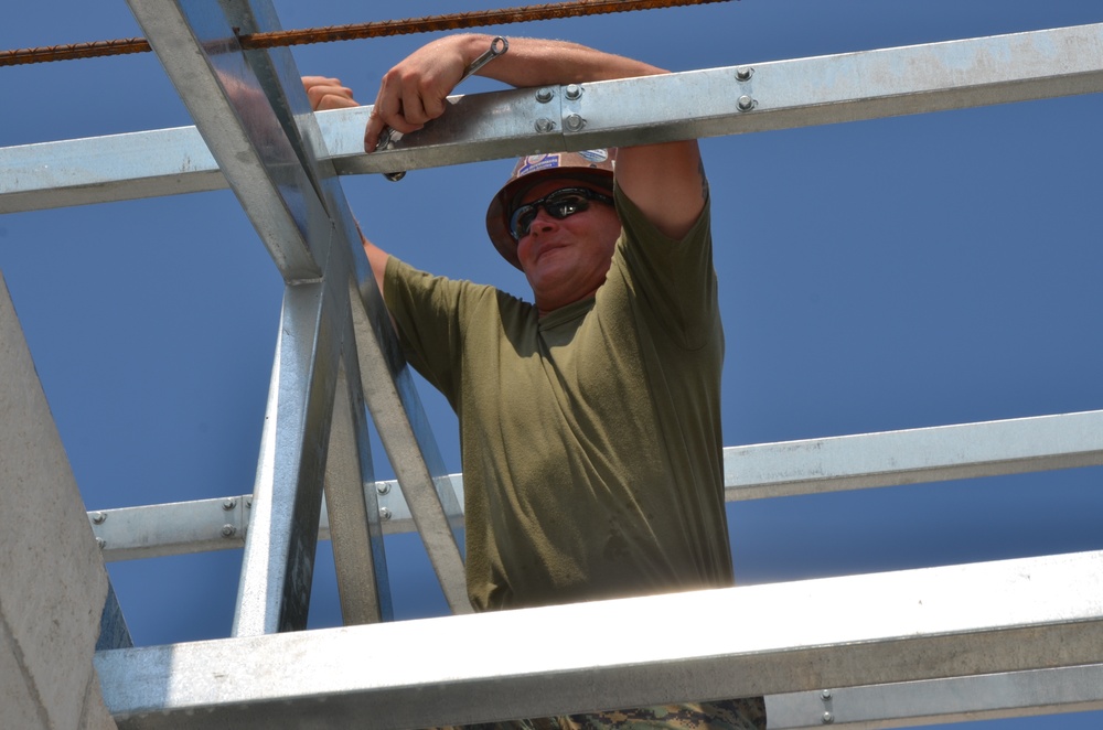 Engineers construct roof at Yorke school construction site in Belize City